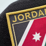 Jordan Al Nashama Polo Shirt — badge close-up detail